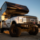 Image for article titled A Ford F-350 With Huge Tires And A Lance 855S Camper Makes A Comfy Portable Home